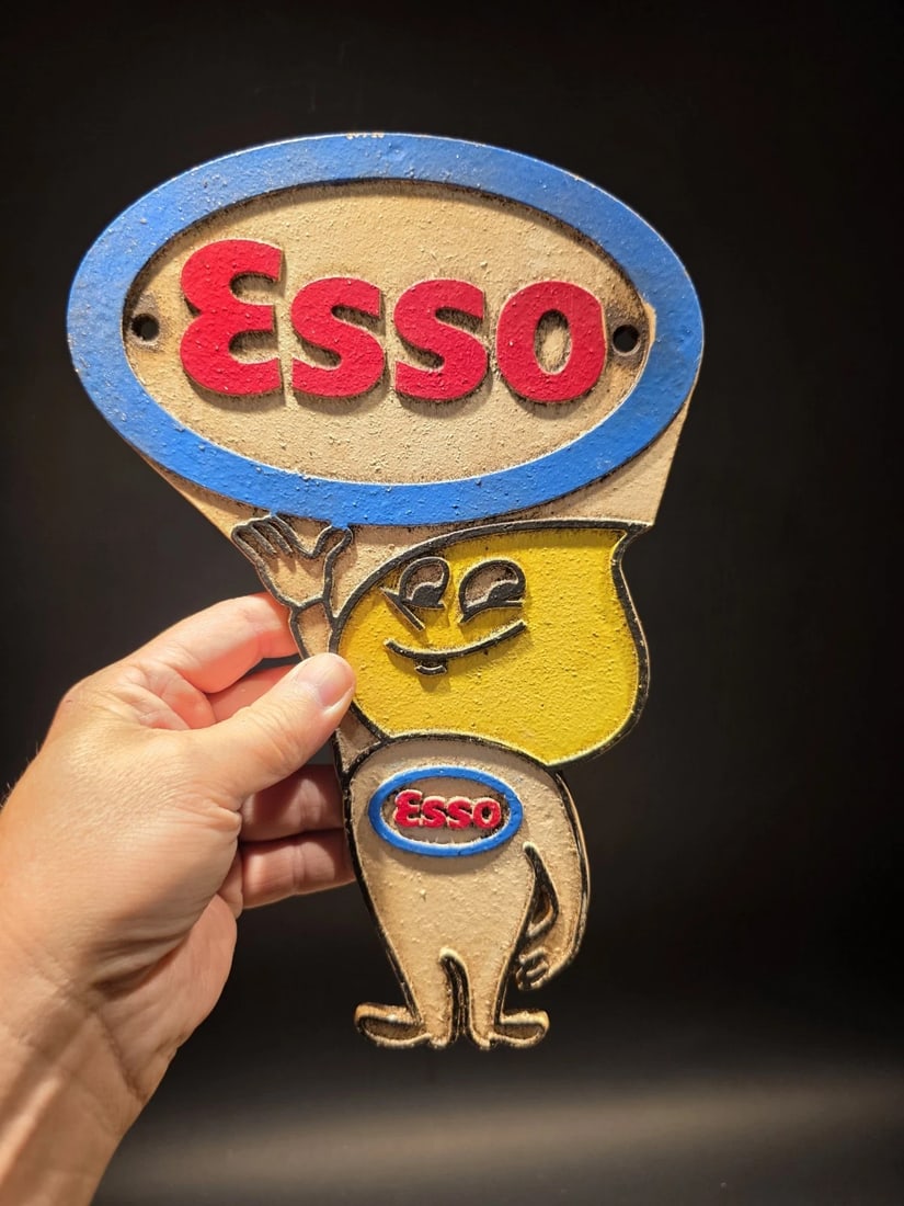 11" Gas Station Advertising Esso Oil Drop Cast Iron Sign: 11" tall Cast iron Esso Oil Drop sign inspired by classic American gas station advertising. The design features the recognizable Esso oval logo along with the smiling oil drop character used in