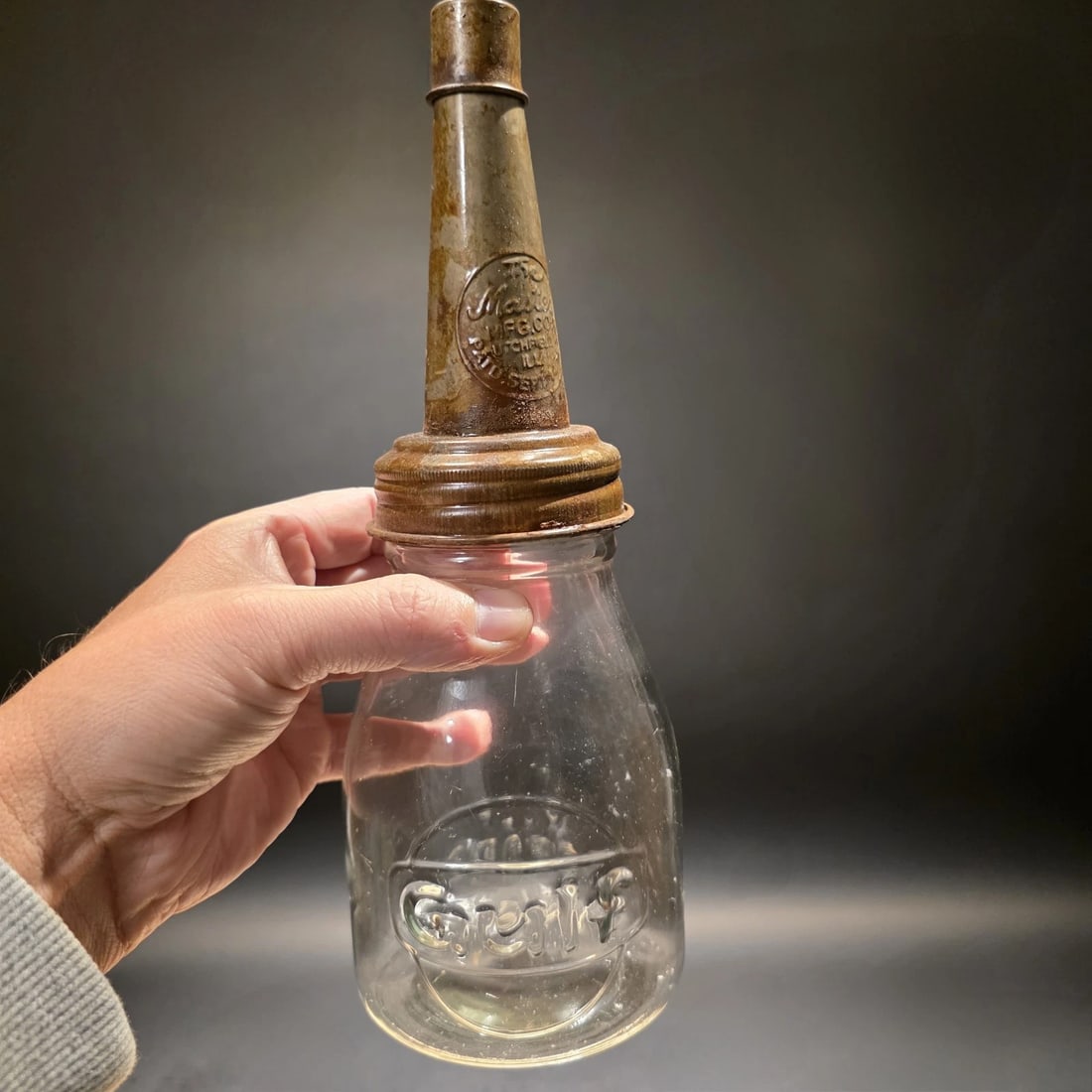 1930s Style Glass Gulf Oil Bottle w Spout: 3.5 W x 17 H Wonderful vintage style reproduction Gulf motor oil bottle with its spout. Such a neat reproduction glass oil bottle. Wonderful signs of wear and distress. Hard to tell its age! Looks