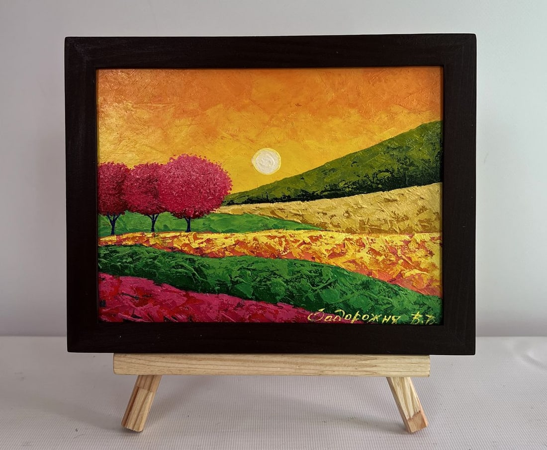Oil painting Blooming trees in the field V. Zadorozhnya: NoAAA4553The painting "Blooming Trees in the Field" is a stunning depiction of nature's beauty, capturing the warmth of a golden sunset and the vibrant energy of a blooming landscape. The artist