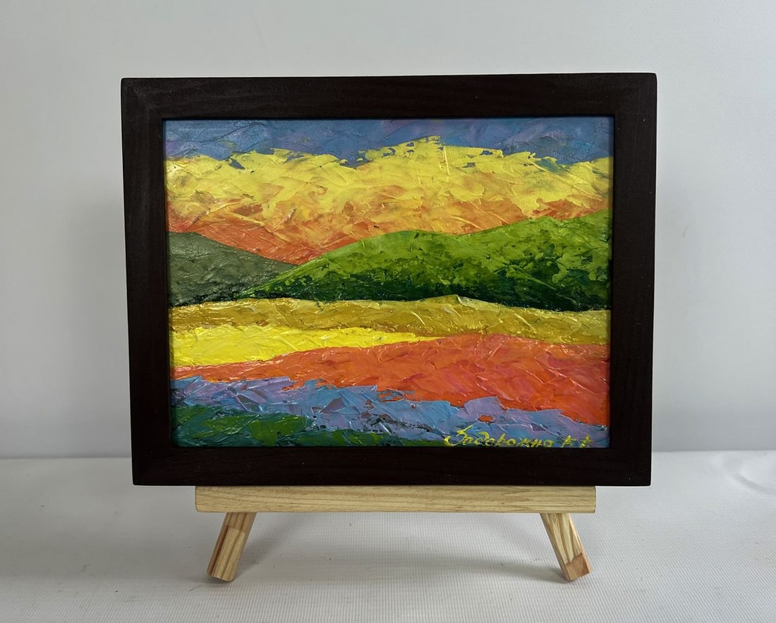 Oil painting Fiery sunset behind the mountains V. Zadorozhnya: NoAAA4611The oil painting on cardboard titled "Fiery Sunset Behind the Mountains" is a vibrant, emotionally charged landscape that captures the raw beauty of nature through expressive color and textur