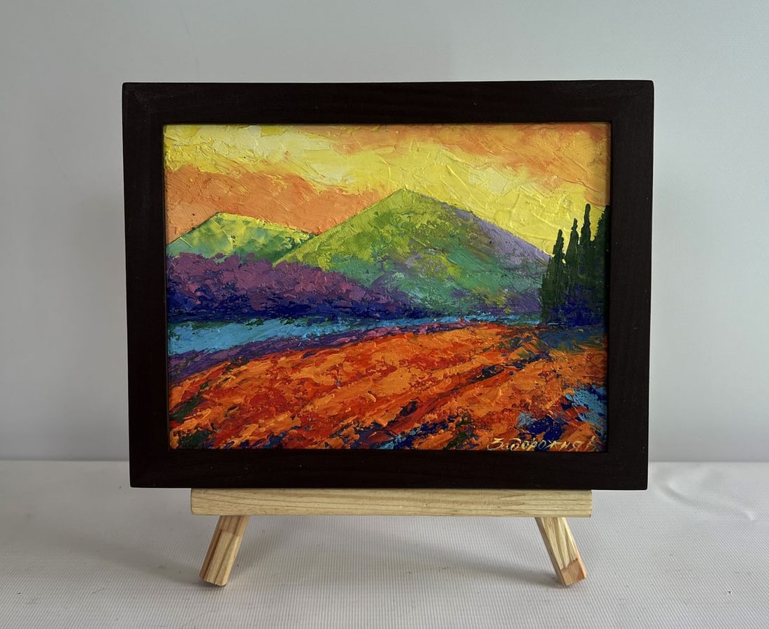 Oil painting Evening walk near the mountains V. Zadorozhnya: NoAAA4634The oil painting on cardboard titled "Evening Walk Near the Mountains" captures the serene and breathtaking beauty of a landscape bathed in the golden hues of the setting sun. The artist's