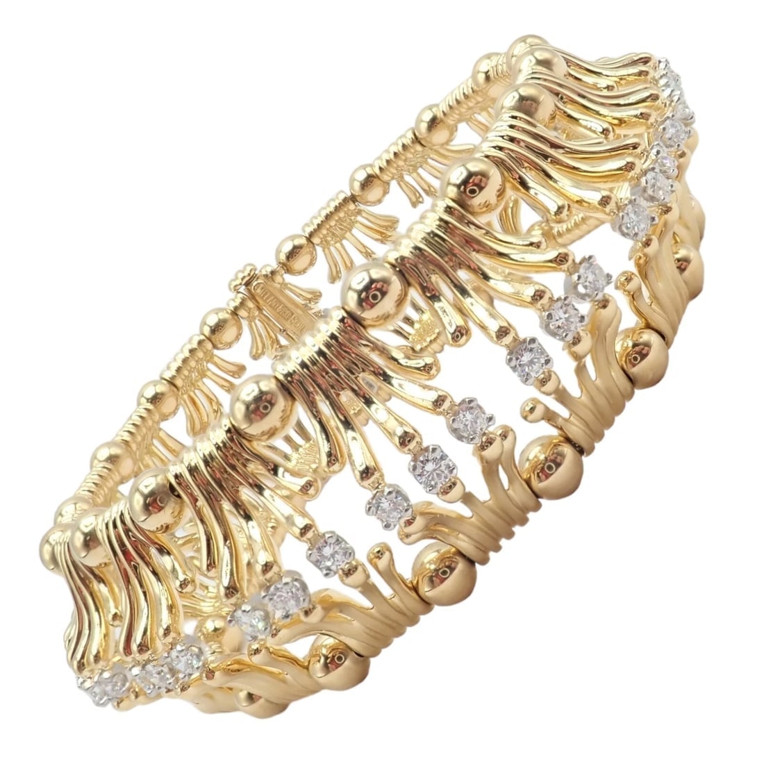 Tiffany & Co Jean Schlumberger 18k Yellow Gold Platinum Diamond Hands Bracelet: Tiffany & Co Jean Schlumberger 18k Yellow Gold Platinum Diamond Hands Bracelet About This Piece: The Tiffany & Co. Jean Schlumberger 18k Yellow Gold Platinum Diamond Hands Bracelet is a masterpiece of