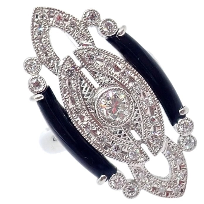 Vintage Estate Platinum Diamond 0.62ctw Onyx Ring sz 7.5: Vintage Estate Platinum Diamond 0.62ctw Onyx Ring sz 7.5 About This Piece: This vintage estate ring is crafted in platinum and showcases a striking Art Deco design. Featuring 0.62 carats total weight 