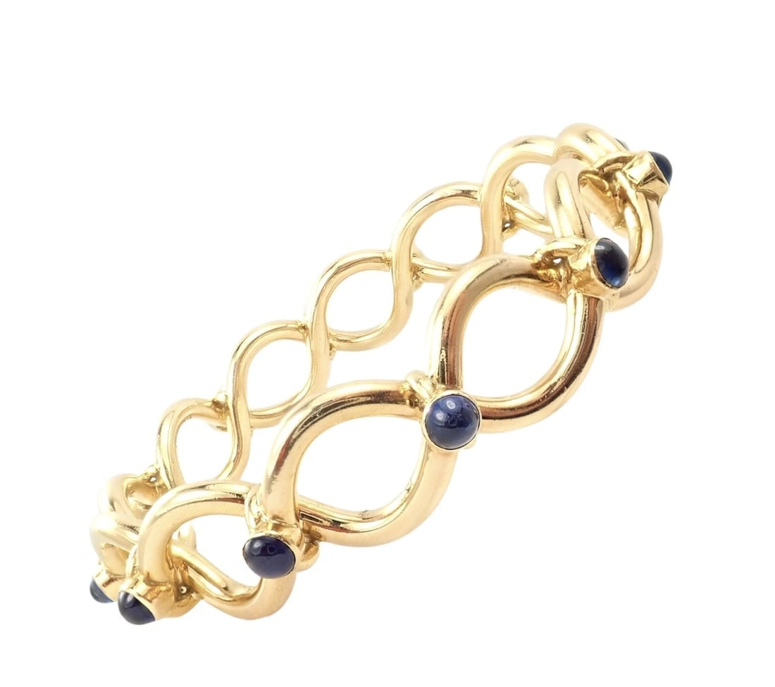 Rare! Authentic Tiffany & Co 18k Yellow Gold France Sapphire Bangle Bracelet: Rare! Authentic Tiffany & Co 18k Yellow Gold France Sapphire Bangle Bracelet About This Piece: Metal: 18k yellow gold Length: 7.25" Weight: 81 grams Width: 15mm Hallmarks: Tiffany & Co France 18kt JW