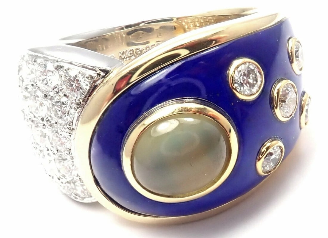 Rare! Authentic Mikimoto Platinum & 18k Gold Diamond Cats Eye Enamel Band Ring: Rare! Authentic Mikimoto Platinum & 18k Gold Diamond Cats Eye Enamel Band Ring About This Piece: Includes: Box Metal: Platinum And 18k Yellow Gold Stones: Diamonds VS1 clarity, G color total weight ap