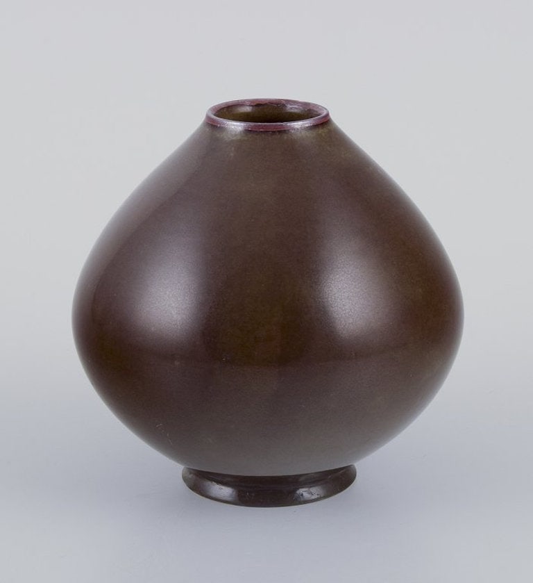 Royal Copenhagen. Chubby shape ceramic vase. Aubergine glaze. 1930s/40s.: Title: Royal Copenhagen. Chubby shape ceramic vase. Aubergine glaze. 1930s/40s. Description: Royal Copenhagen, ceramic vase. Aubergine glaze. Chubby shape. 1930s/40s. Marked. In excellent condition.