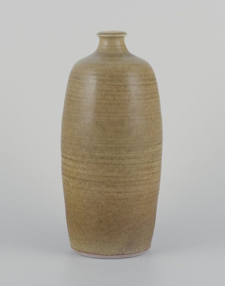 Danish studio ceramicist. Ceramic vase with aubergine glaze. (1 of 6)