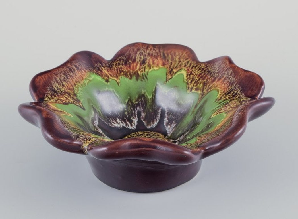 Vallauris, France. Ceramic bowl in multicoloured glaze. Circa 1970s.: Title: Vallauris, France. Ceramic bowl in multicoloured glaze. Circa 1970s. Description: Vallauris, France. Ceramic bowl in multicoloured glaze. Wavy shape. Circa 1970s. In perfect condition. Dimensio