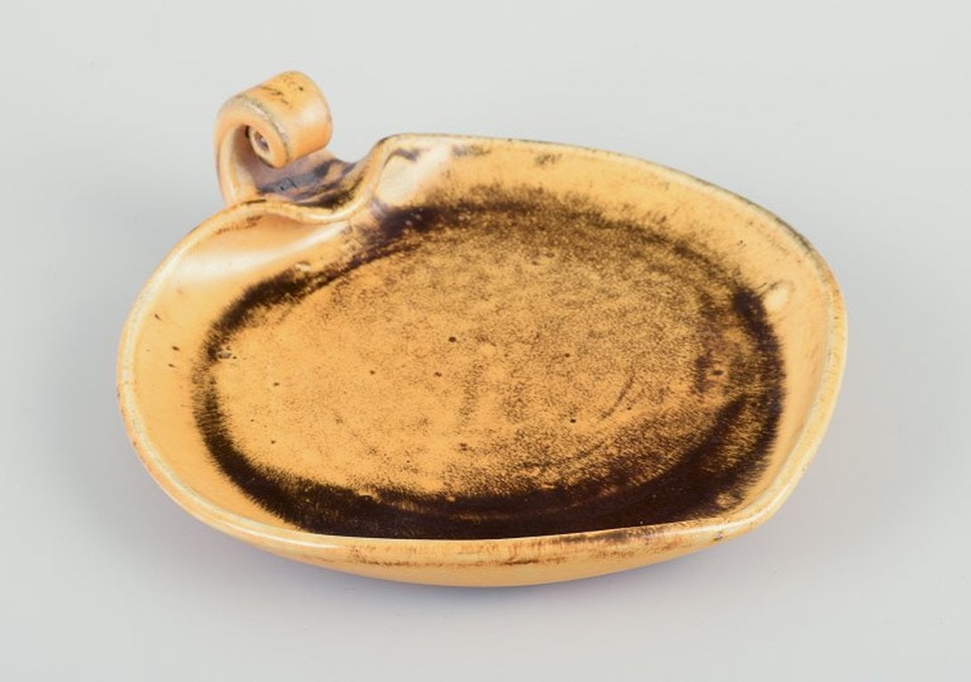 Kähler, Denmark. Heart-shaped dish in ceramic. Circa 1930s.: Title: Kähler, Denmark. Heart-shaped dish in ceramic. Circa 1930s. Description: Kähler, Denmark. Heart-shaped dish in ceramic. Uranium yellow glaze. Handmade. Circa 1930s. Marked. In