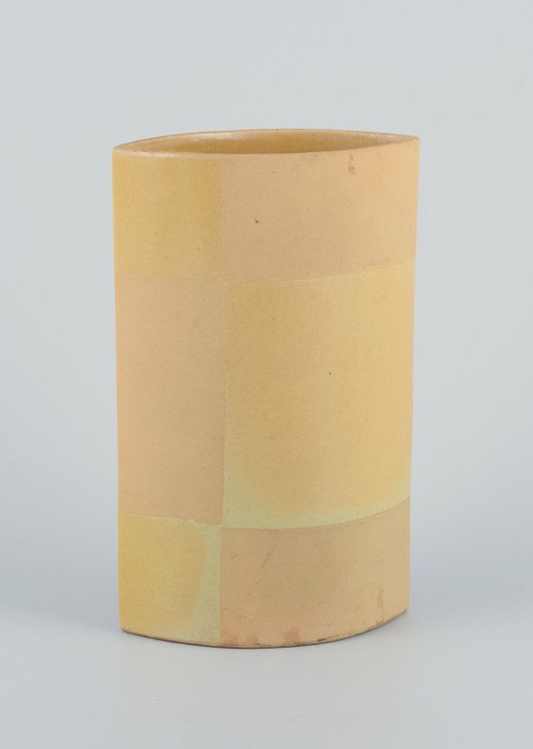European studio ceramicist. Unique ceramic vase. Circa 1980s.: Title: European studio ceramicist. Unique ceramic vase. Circa 1980s. Description: European studio ceramicist. Unique ceramic vase. Yellow glaze. Glazed and unglazed. Circa 1980s. Indistinct artist