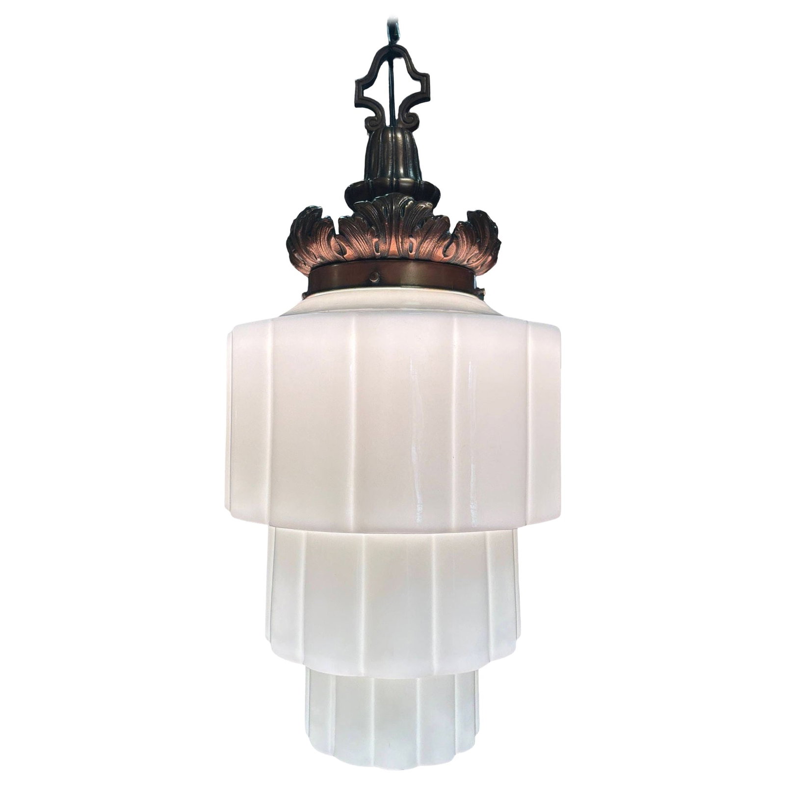 Art Deco Era Ornate Brass Pendant Light w/ Stepped Milk Glass Skyscraper Shade: Title: Art Deco Era Ornate Brass Pendant Light w/ Stepped Milk Glass Skyscraper Shade Description: This 1930s Art Deco pendant light features a tiered Art Deco milk glass shade featuring stepped geome