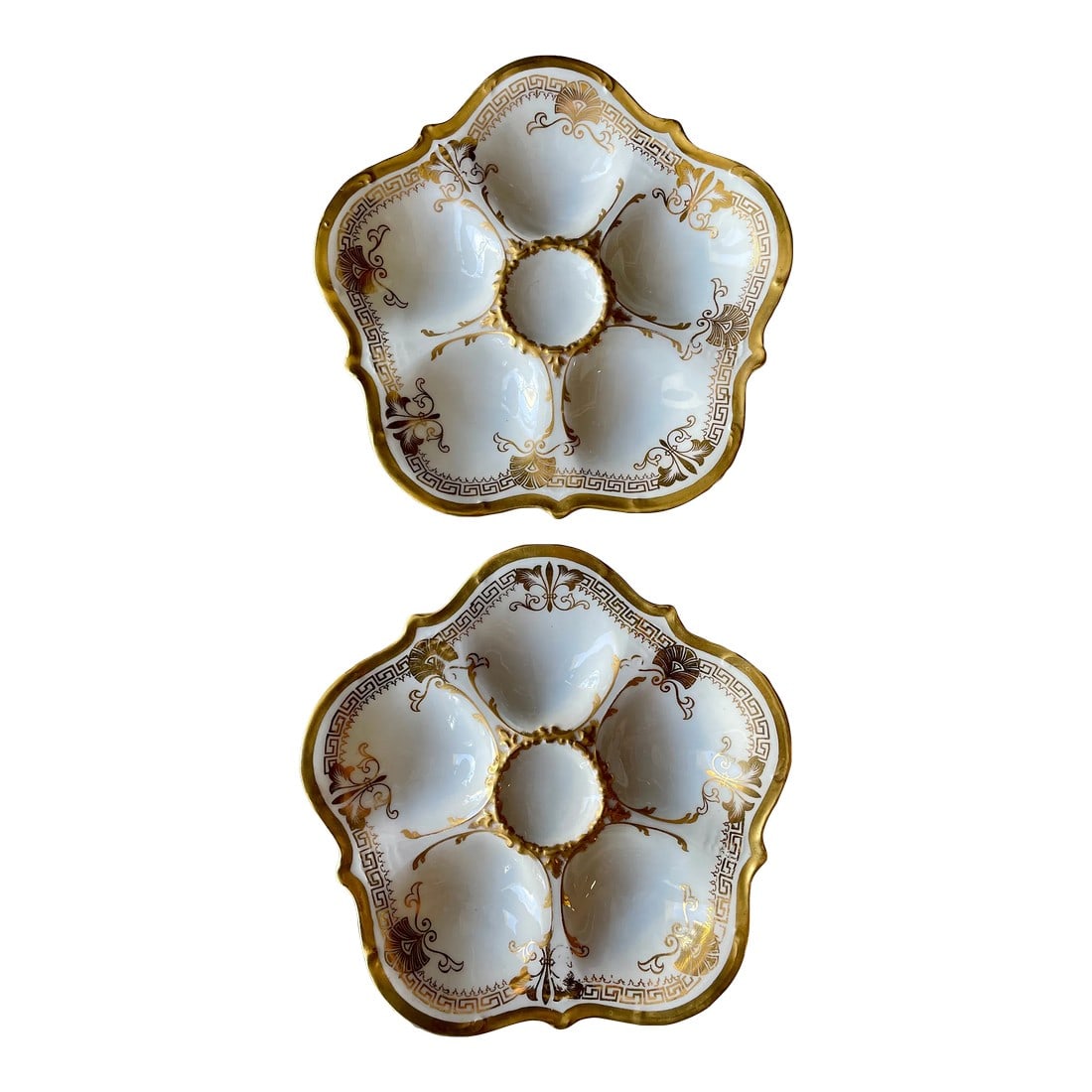 French Limoges Oyster Plates for Higgins & Seiter in Ny, a Pair: A good pair of Porcelain plates from Limoges, France made for Higgins & Seiter in NY, five oyster wells with gold leaf decor. In great condition. Dimensions are 8.75' diameter by 1" thick. # 81401