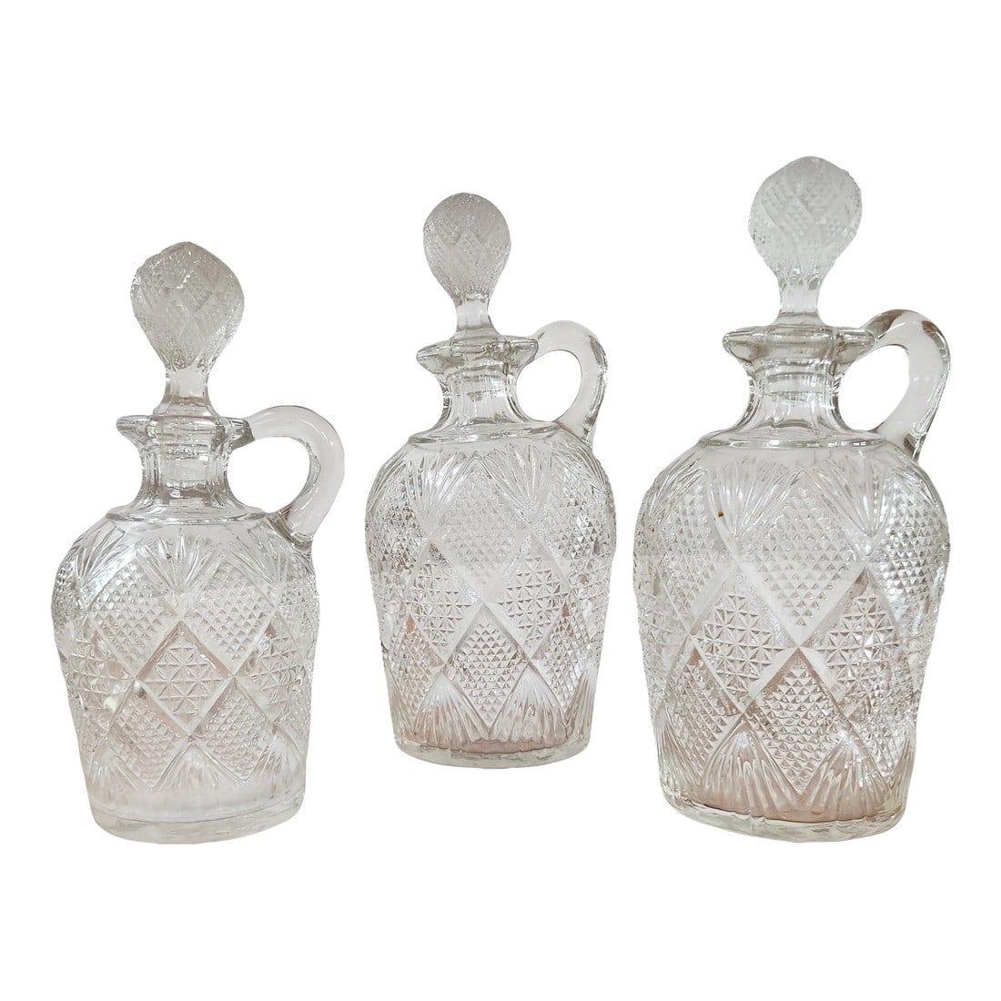 Set of 3 Antique Late 19th Century Brilliant Cut Glass Decanters With Ball Stoppers and Loop Handles: Elevate your collection or home decor with this stunning trio of antique cut glass decanters, crafted in the style of the American Brilliant Period (circa 1880–1915). Each decanter features a