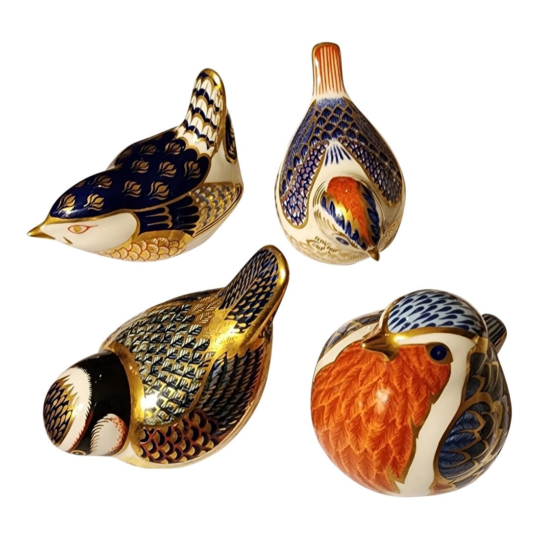 Porcelain Royal Crown Derby Birds Four: Beautiful hand painted Royal Crown Derby Porcelain birds.. Each one is about three inches high...one of the birds is larger 2.5" d 3.75" w and 3"high. Condition: Alterations: Original Condition