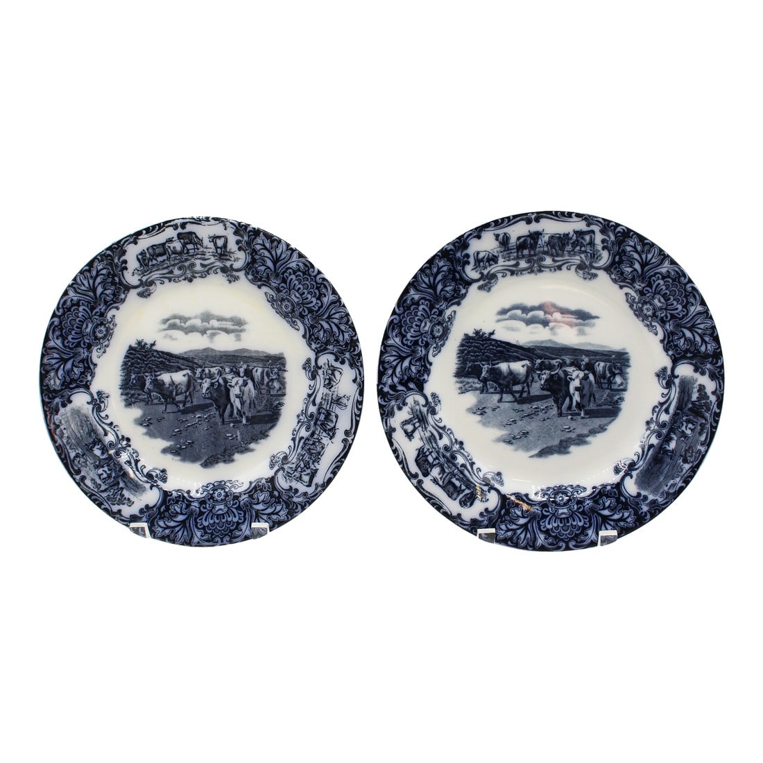 Associated Pair of 1906-08 English Wedgwood Cows Flow Blue Pattern Plates: An associate pair of 1906 & 1908 Wedgwood Cows flow blue pattern plates, English. Reserves of Highlands Cattle surrounded by 3 reserves of short horn cattle grazing & resting. Good overall condition,