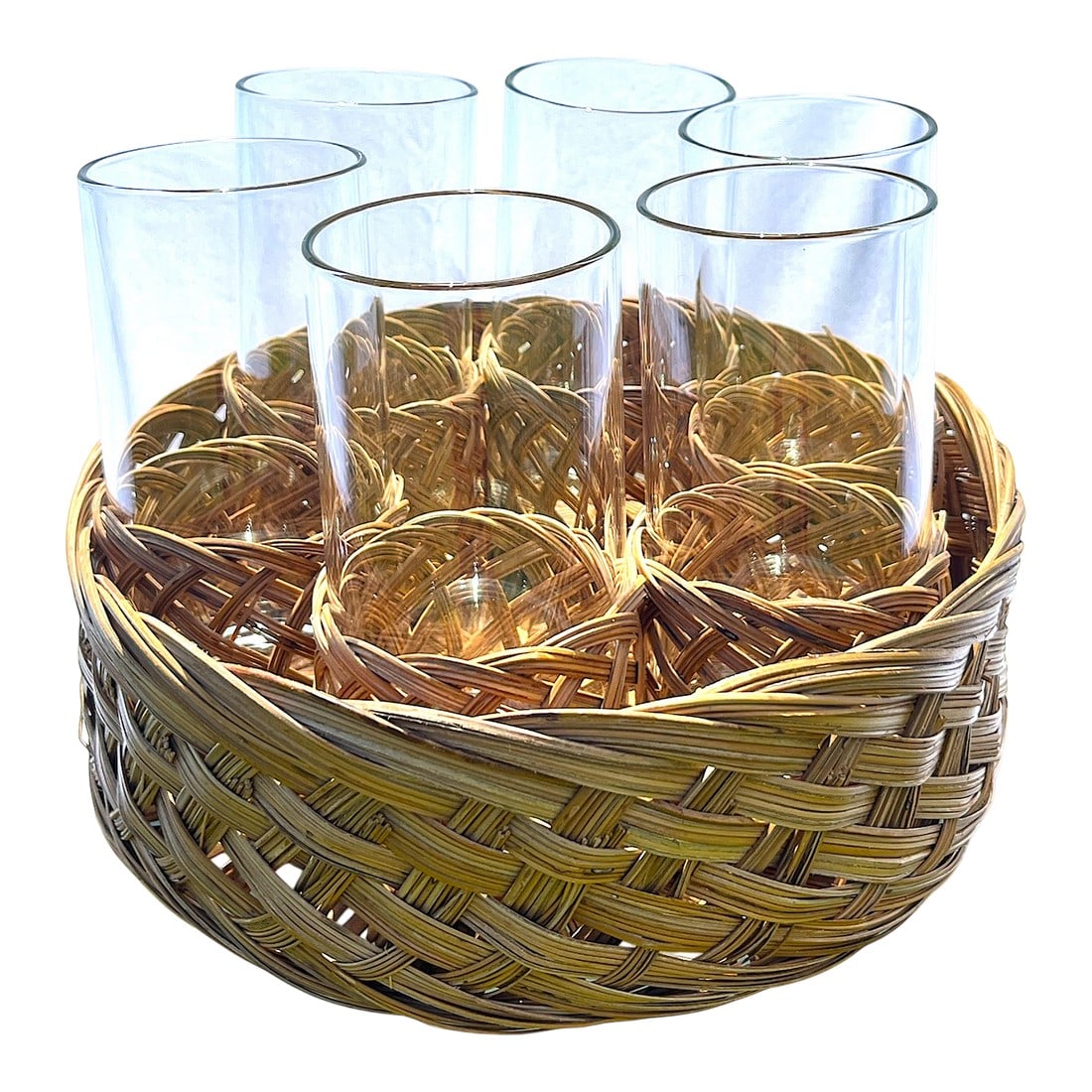Vintage Rattan-Wrapped Drinking Glass Cocktail Ice Tea Set With Matching Woven Tray- 7 Pieces: Set of six clear drinking glasses, each nestled in its own 1970s vintage woven rattan sleeve. The set comes complete with a coordinating round basket tray, perfectly fitted to hold all six glasses "&#