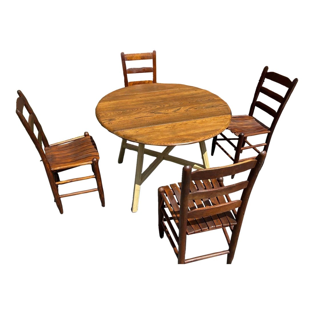 Early 20th Century Round Wooden Dining Table With 4 Ladder-Back Chairs - Set of 5: Create a warm and inviting dining space with this delightful wooden dining set, featuring a classic round table and four coordinating ladder-back chairs. This set embodies a timeless farmhouse or