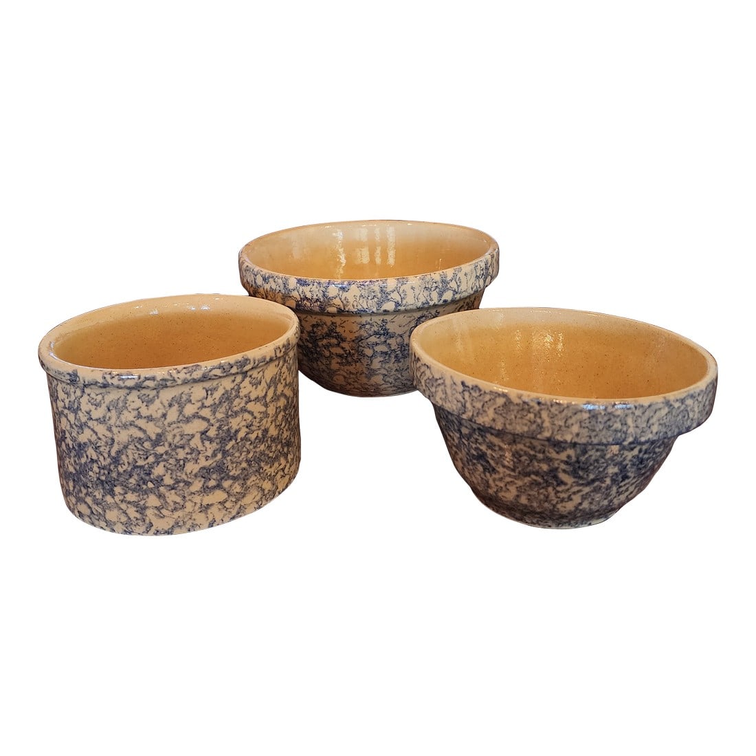Three Vintage Roseville Robinson Ransbottom Blue Sponngeware Bowls: Three Roseville Robinson Ransbottom blue spongeware bowls with speckled glaze. The cylinder bowl measures 4.25"h by 6.5"w. The smaller mixing bowl measures 4.2"h by 7.5"wide , the larger one measures