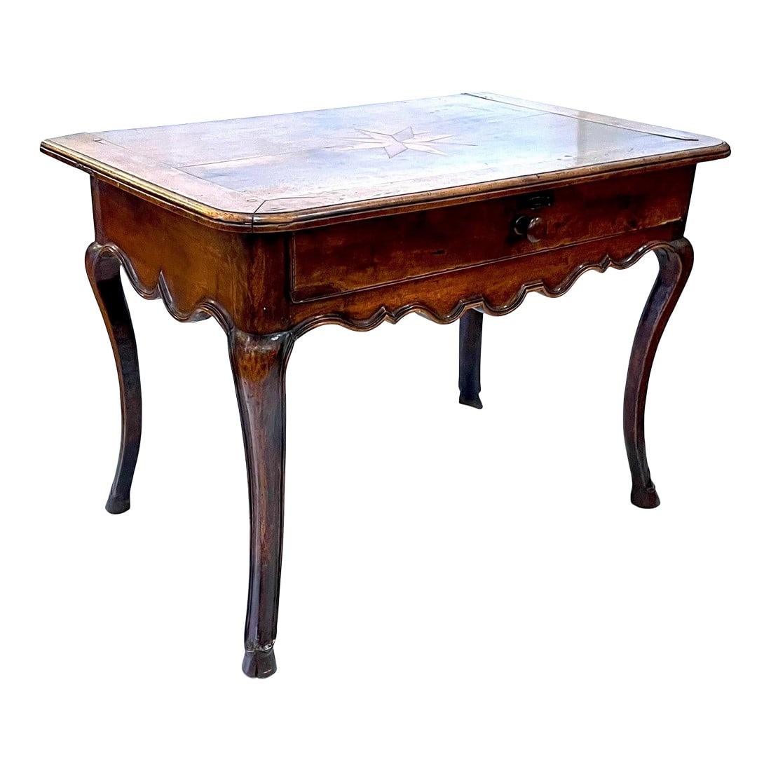 18th Century Louis XV French Provincial Walnut Side Table With Inlaid Top: Unique 18th century Louis XV French solid walnut Provincial side table. Features an inlaid "star" on its top. Hand carved - scalloped apron on front and both sides. Cabriole legs which end in