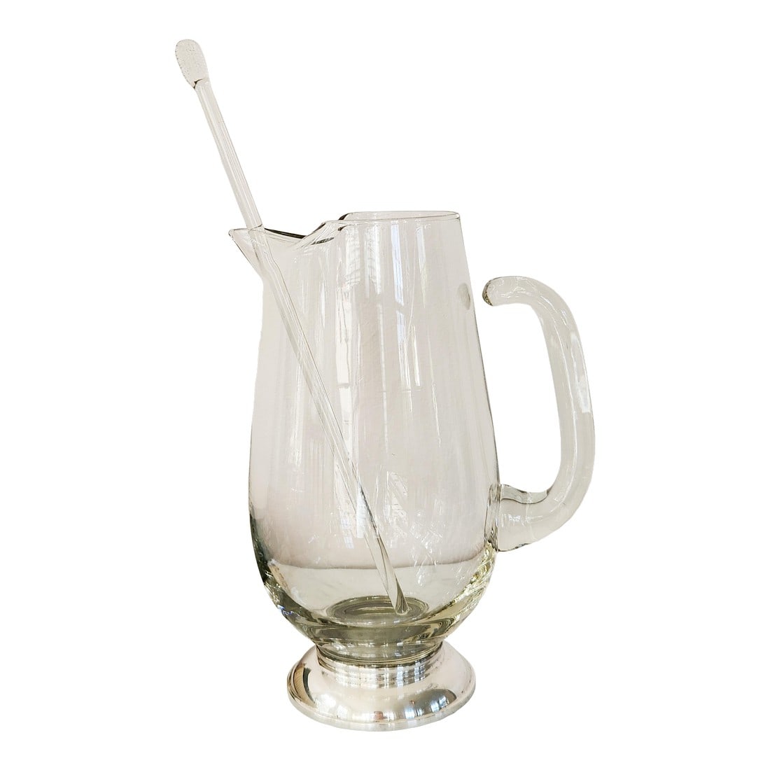 1950s Mid-Century Handblown Glass Pitcher With Sterling Silver Base & Stirrer "” J. Rogers: This exquisite mid-century glass pitcher combines graceful handblown craftsmanship with the refined gleam of sterling silver. Marked "J. Rogers Sterling 20417," the piece features a heavy, clear