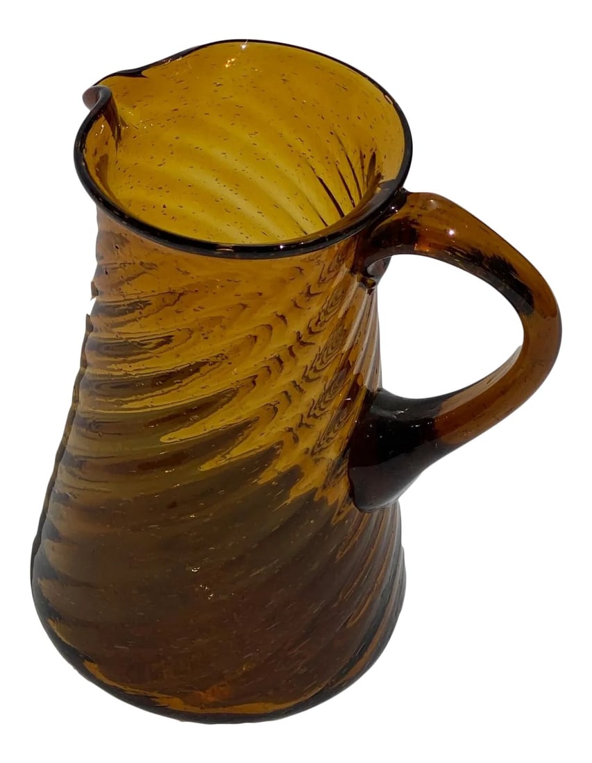Vintage Amber Twisted Ribbed Glass Pitcher: Beautiful hand-blown amber glass pitcher with a twisted ribbed design. Condition: Alterations: Original Condition Unaltered Imperfections: Some Imperfections Condition Notes: Great Condition
