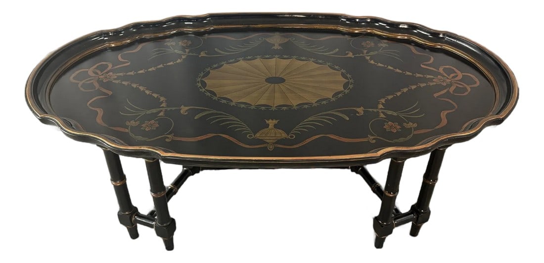 Late 20th Century Attributed to Maitland Smith Ebonized Oval Neoclassical Coffee Table: This elegant Maitland Smith oval coffee table is a refined example of neoclassical design, combining classical proportion with the brand's signature hand craftsmanship. The elongated oval silhouette