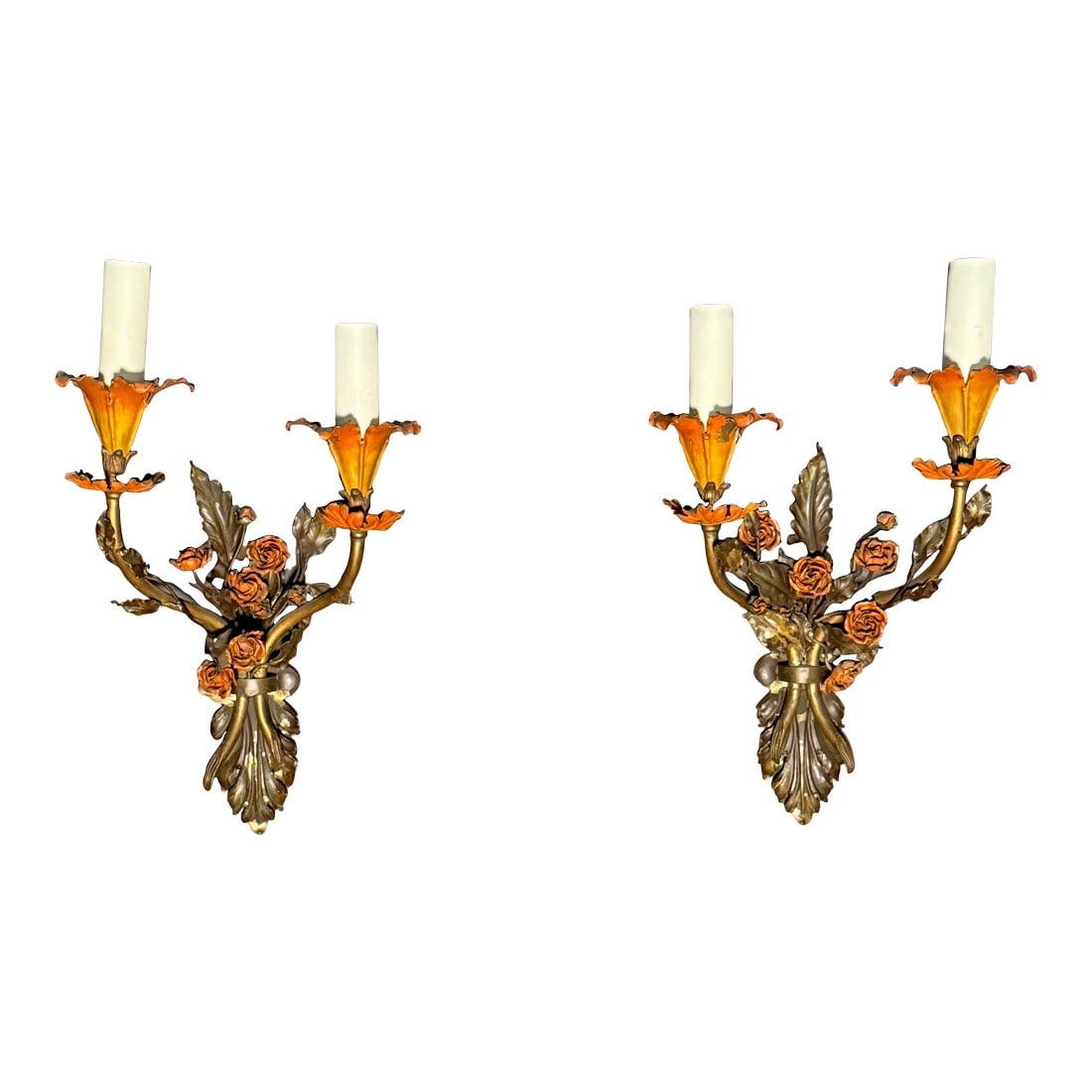 Early 20th Century Attributed to Edward F. Caldwell & Co. Pair of Painted Tole Floral Wall Sconces: Pair of early 20th century floral wall sconces attributed to the Caldwell Manufacturing Company, American, circa 1910–1920. Executed in painted tole over brass or bronze, each sconce features tw