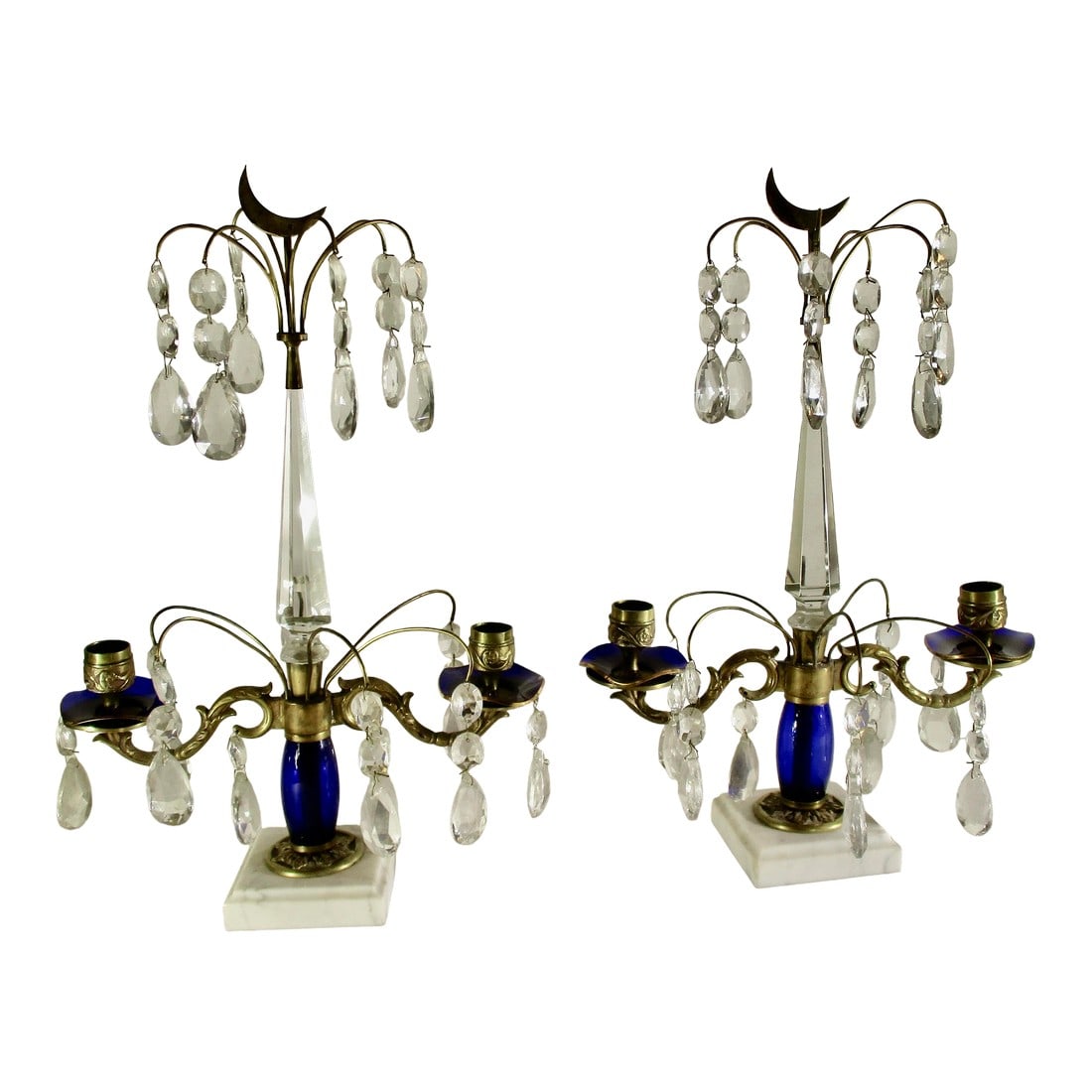 Swedish Girondals MCM With Blue and Clear Crystals - A Pair of 2: Swedish style from the 20's or 30's with dark blue crystal elements and clear teardrops. Central spire with branching arms for candles. The center has arranged soft brass arcs of teardrops. The base