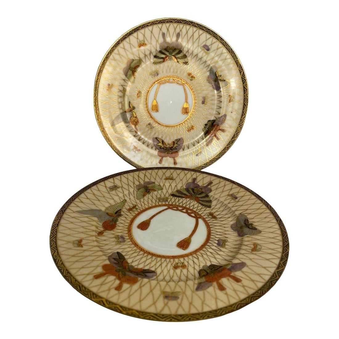 Pair of Meiji Period Japanese Gilt Porcelain Butterfly Plates, Circa 1890: This elegant pair of Japanese porcelain plates dates to the late Meiji period, circa 1890, and showcases the refined decorative sensibility that defined Japan's golden age of ceramic artistry. Each
