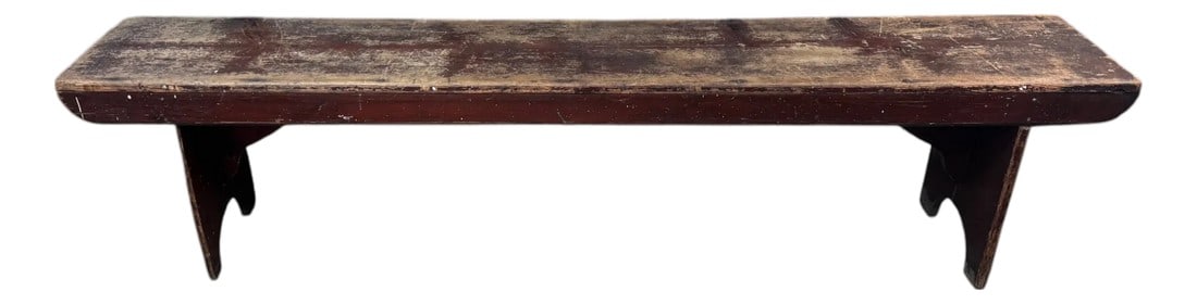 Early 20th Century Primitive Bench: This primitive wood bench showcases the charm of early American country furniture. Featuring a long, single-board seat with a deeply patinated finish, supported by classic board-end legs with