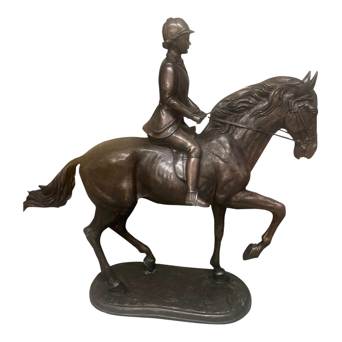 Antique-Style Bronze Equestrian Sculpture of a Young Rider: This elegant bronze sculpture captures a moment of poised athleticism, featuring a young rider"”likely a boy in hunt or show attire"”astride a spirited horse. Rendered with fine attention