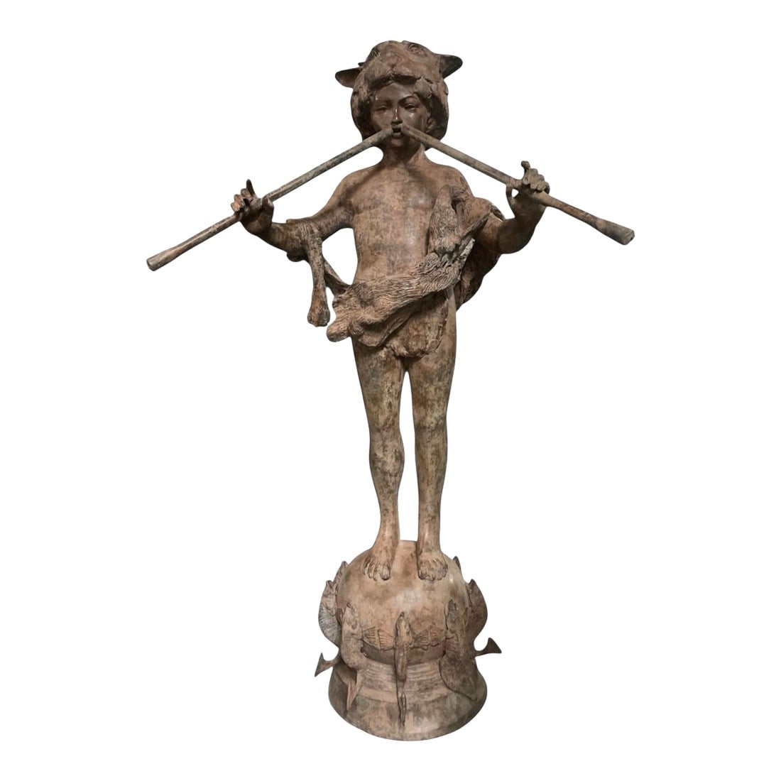 Vintage Neoclassical Patinated Bronze Fountain – Boy Playing Double Flute on Fish Base: An enchanting and finely detailed vintage garden fountain crafted in heavy, patinated bronze. This sculptural piece depicts a youthful figure, reminiscent of a forest faun or Pan, wearing a unique ani