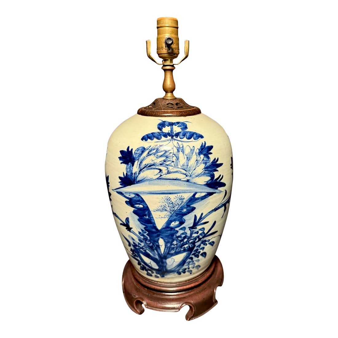 19th Century Chinese Celadon, Blue and White Porcelain Lamp: A striking 19th century Chinese porcelain ginger jar converted as a table lamp, featuring a classic baluster-form body decorated in underglaze cobalt blue against a soft celadon ground. The