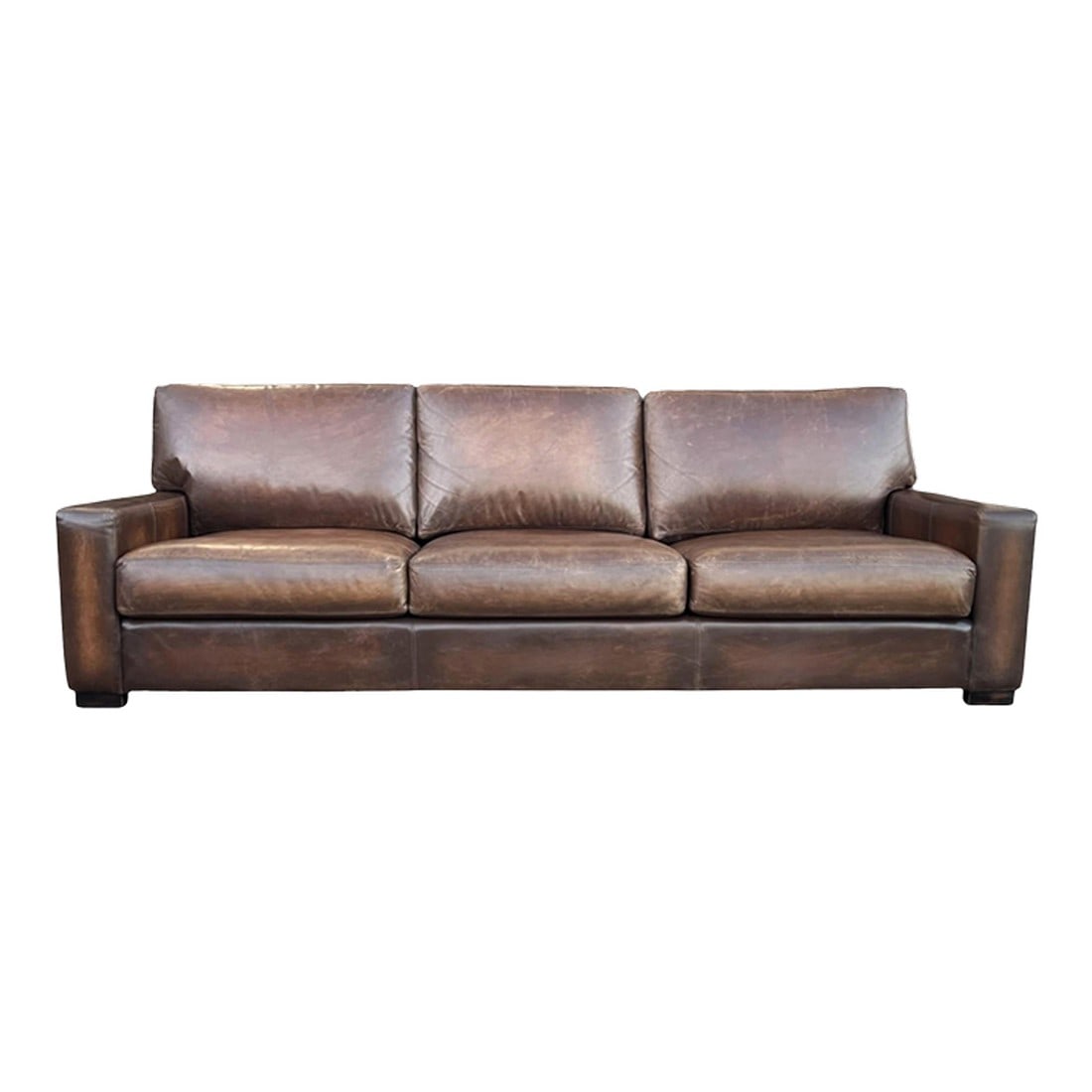 1980s Large Deep-Seated Two-Tone Brown Leather Sofa With Vintage Patina: This large and inviting leather sofa features a clean, sleek design paired with deep seating for exceptional comfort. Upholstered in rich leather, the piece has been dyed in a beautiful two-tone brown