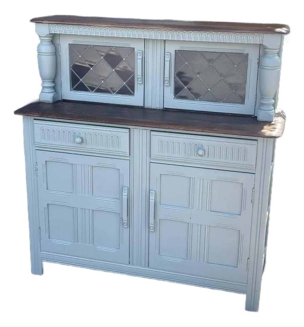 Original Ercol Old Colonial Buffet Sideboard 1960s Blue Label: Original Ercol Old Colonial Buffet Sideboard 1960s Blue Label A really unusual buffy court cupboard dating from around the 1950s in the Jacobean colonial style solid Elm tops leaded glass doors, two
