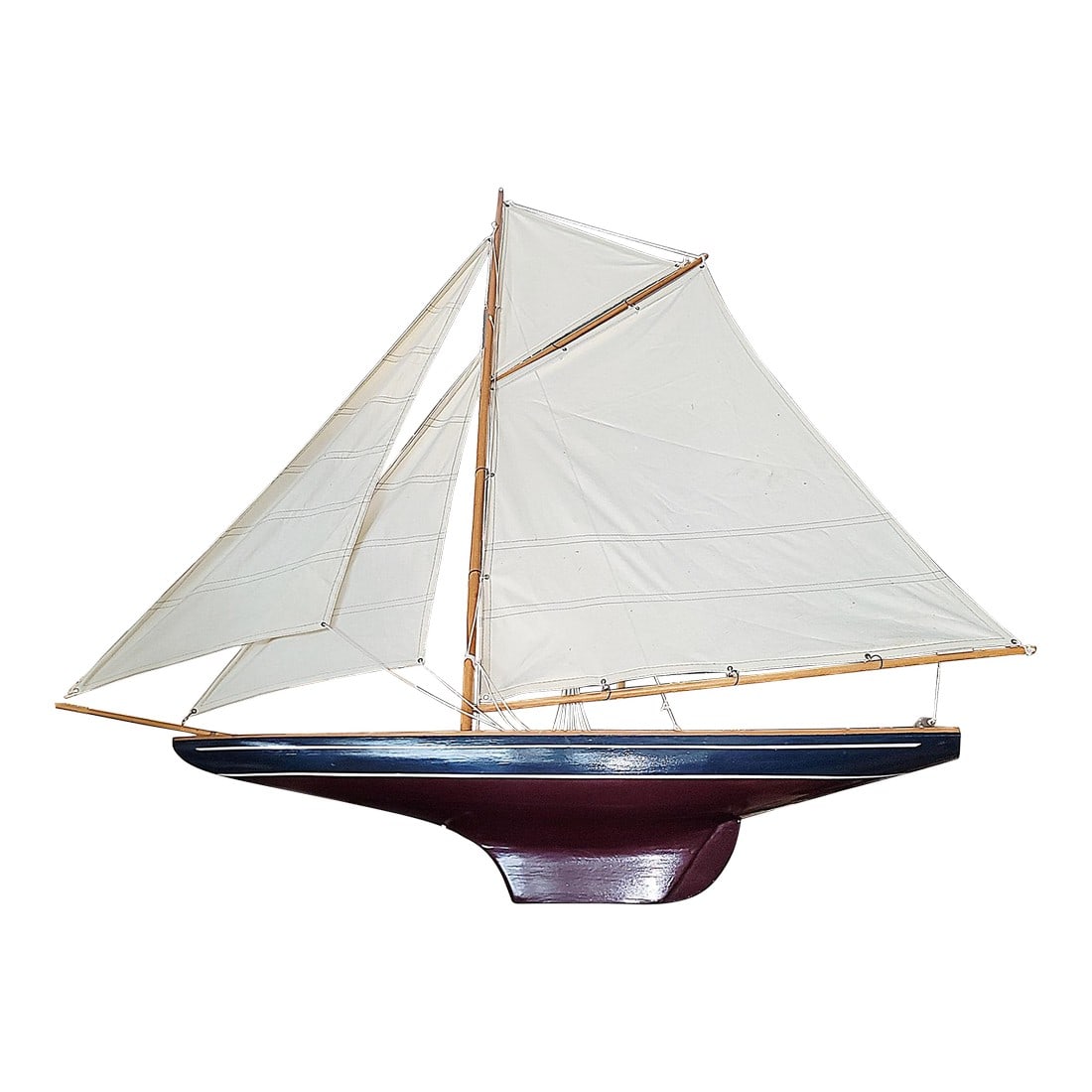 1960s Large Sailboat Model: The beauty and grace of a classic gaff rigged sloop is admired even by landlubbers and this vintage wooden model on stand doesn't disappoint. Detailed deck, cotton sails and a deep blue hull. Conditio