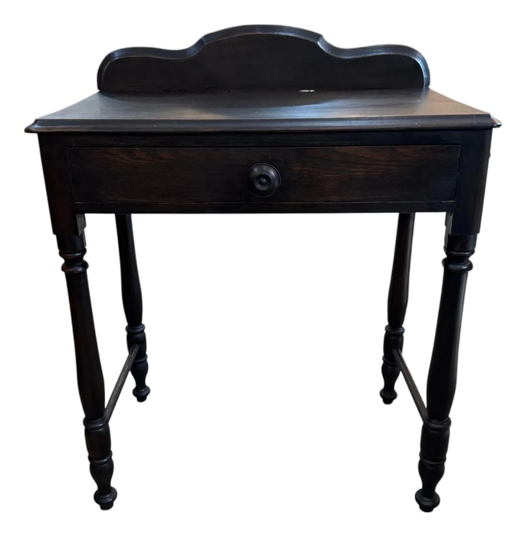 Vintage Ebonized Wood Side Table With Drawer & Gallery Back: A charming vintage side table in a rich ebonized finish that highlights the wood grain. It features a single drawer with a classic round knob and a gently scalloped gallery back for added character