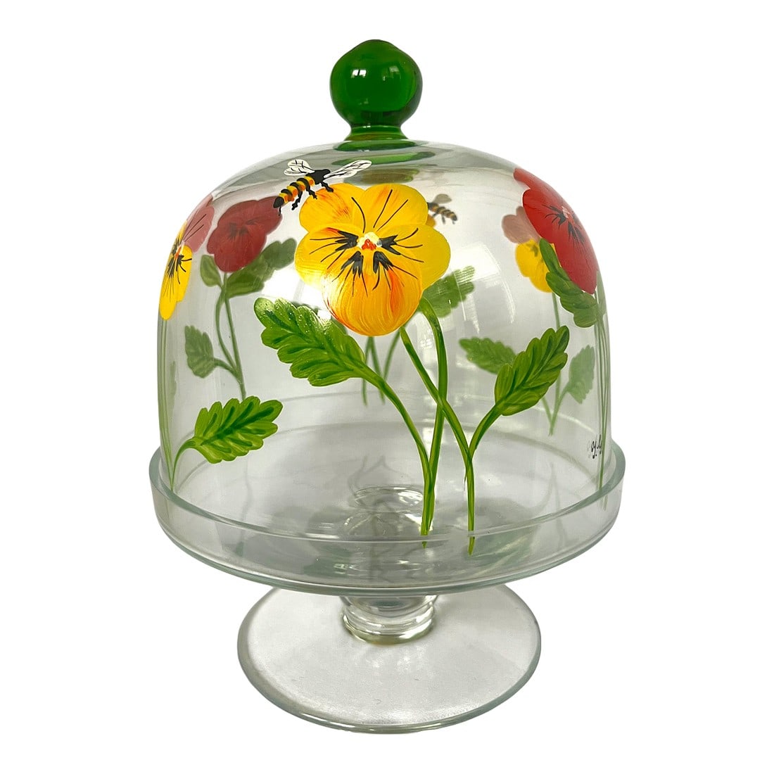 Signed and Hand-Painted Glass Cake or Dessert Stand With Cloche Lid Decorated With Flowers and Bees: Add a charming, garden-inspired touch to your table or display with this beautifully hand-painted glass cloche and pedestal stand. Featuring vibrant pansy-style flowers in red, yellow, and soft pink