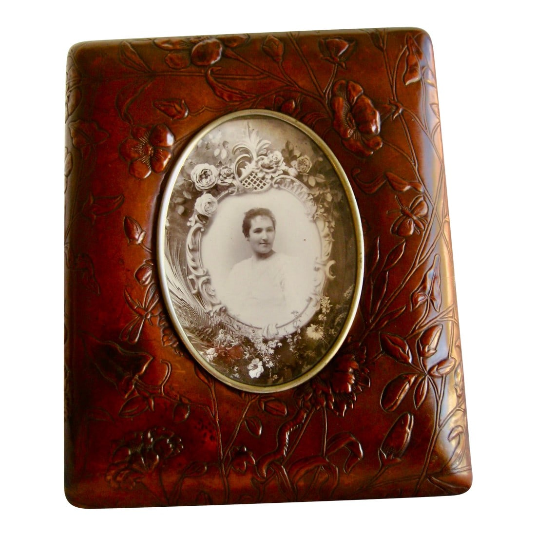 Late 19th Century French Art Nouveau Leather Picture and Frame Album: This very rare piece is multifunctional it s a picture album but also a picture frame , it is a french art nouveau period piece in embossed leather with a naturalist decor of plants and insects , in