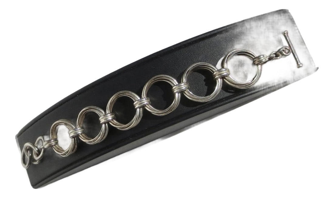 Sterling Silver Toggle Bracelet 9" Long: Marked on the toggle 925 and INDIA. Each link is composed of 5 links joined by a smaller double band. A design of braided links. The measurements are 9" by 1". The weight is 39.4 Dwt. Good condition.
