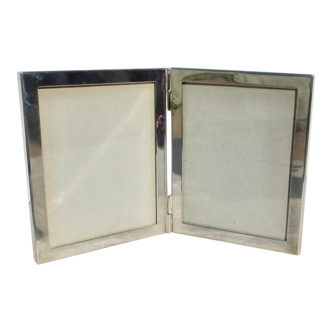 Sterling Silver Tiffany Double Window Frame: Sterling silver modern frame with two windows. Modern design with black lucite back panels. marked Tiffany & Co. with Italian assay marks and Sterling. Hinged together., Free-standing frame. The