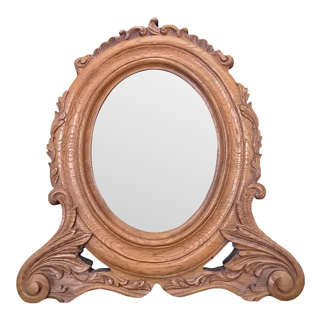 Antique Victorian-Style Oval Tabletop Picture Frame With Original Beveled Glass: This item is a vintage wooden oval tabletop picture frame in an early 20th century style with an ornate, carved design. The stylized carvings feature acanthus foliage and scrollwork details, enhanced