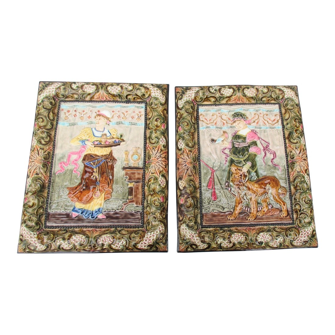 Majolica Plaques by Steidal Znaim- Circa 20s a Pair of 2: Original art by Carl Borner circa 1880s. Later issued in iron plaques by Bradley Hubbard. The pair is a majolica pair from the early 20th century, a Victorian revival ceramic. The pair is scenes from