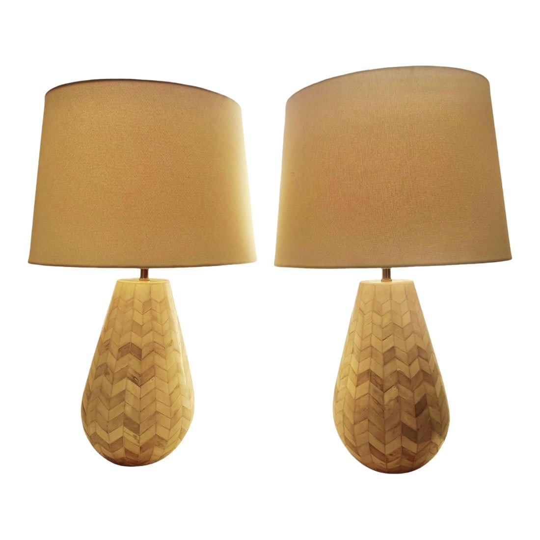 Attributed to Serena and Lily Inlay Lamps - a Pair: Pair of ivory and white lamps with chevron-pattern inlay and ivory-colored linen shades, attributed to Serena and Lily. Condition: Alterations: Original Condition Unaltered Imperfections: Some Imperfe