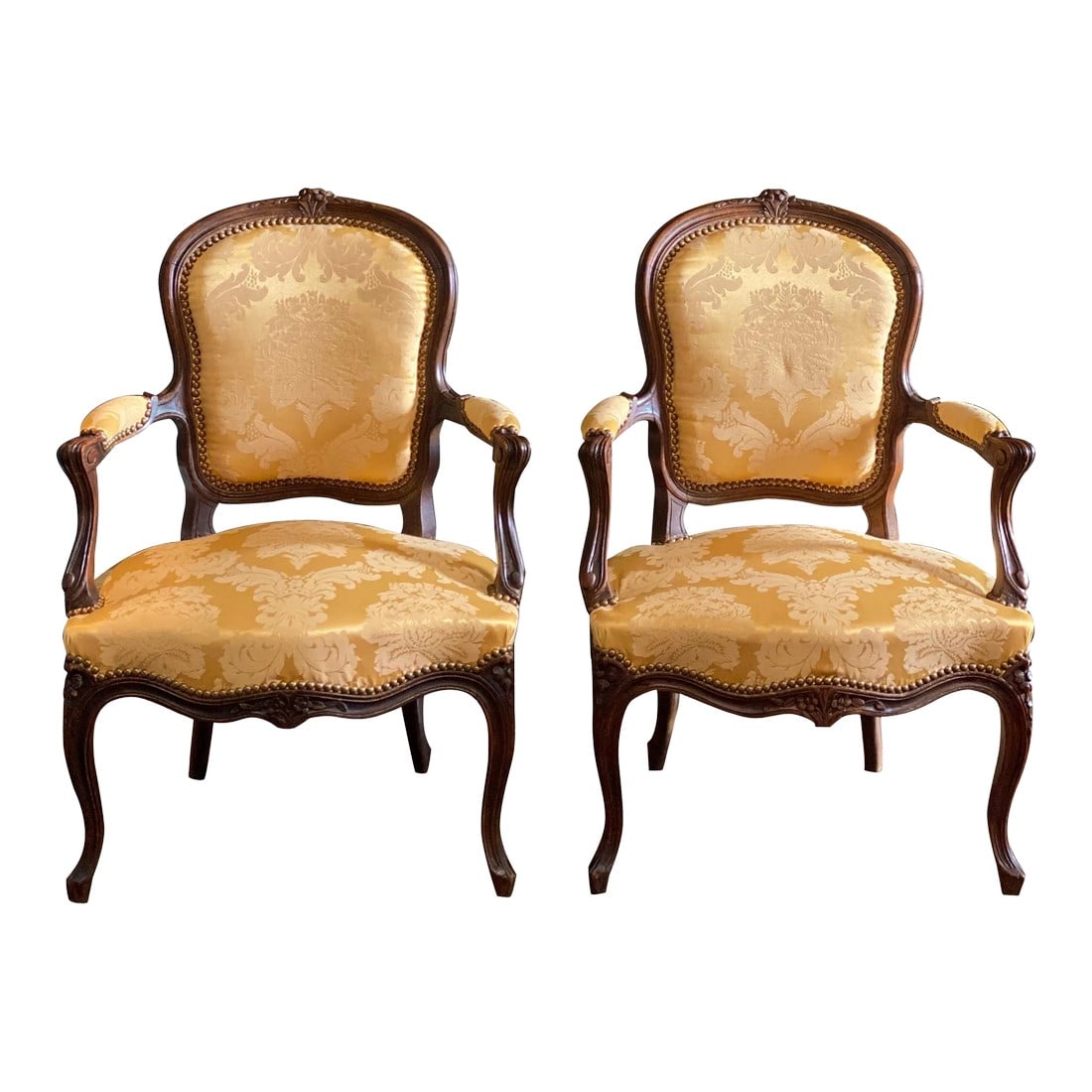 Mid-19th Century French Carved Louis XVI Armchairs - a Pair: Pair of 19th century Louis XVI style fauteuils armchairs, in overall excellent condition. Newly reupholstered. Condition: Alterations: Original Design Modified Imperfections: Some Imperfections Condit