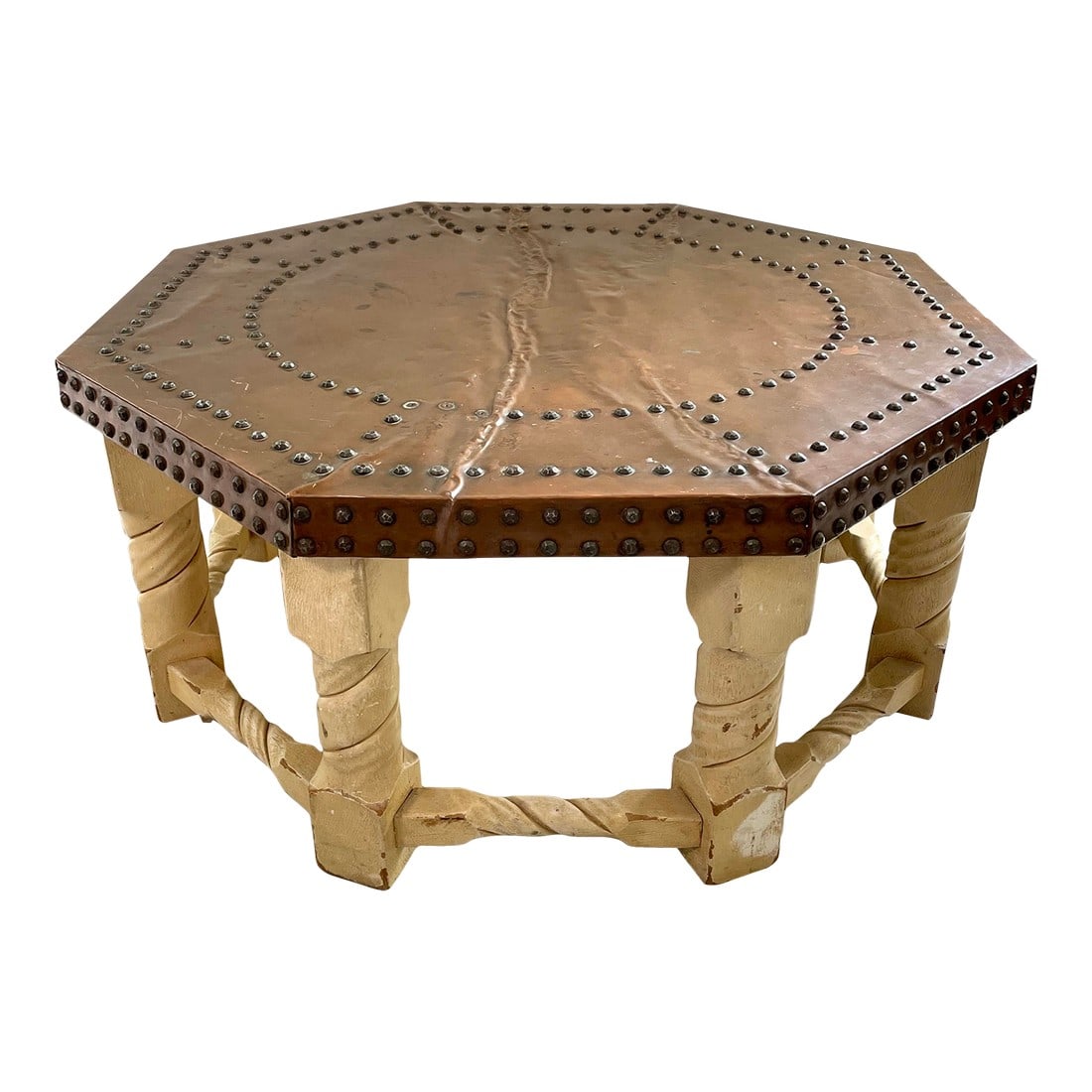 1960s Brown-Saltman Spanish Mission Style Copper-Top Octagonal Cocktail Table: With a single large sheet of copper covering the top and brass nail head trim, this octagonal table will add the texture and richness of natural materials to your interior. It has a Spanish flair,
