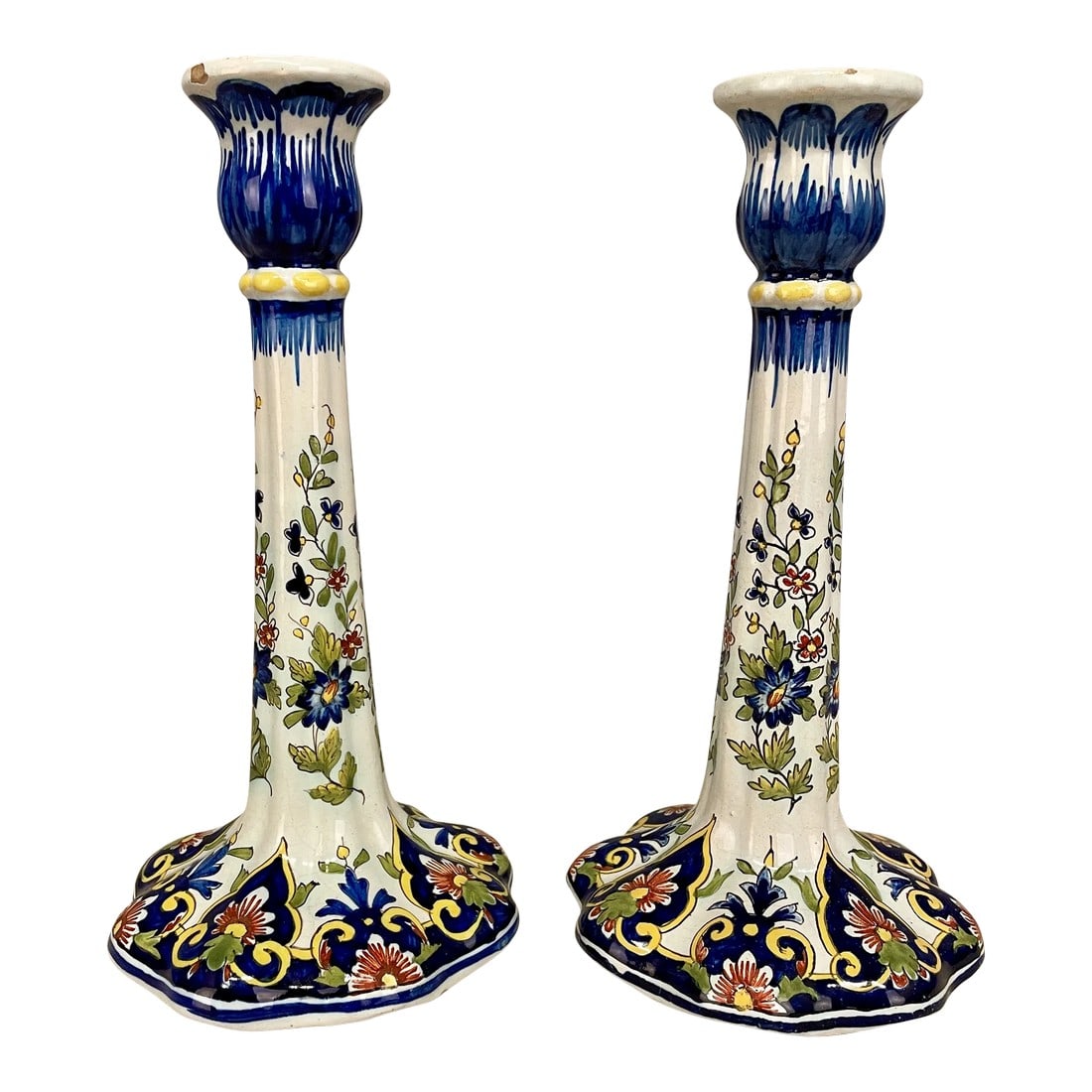 An Early 20th Pair of French Faience Candlestick: An early 20th pair of French Faience Candlestick with the Rouen Decor, from the faiencerie of Desvres, signed on bottom Mosanic. Note : one chip on the top. See last picture. Dimensions are 5"