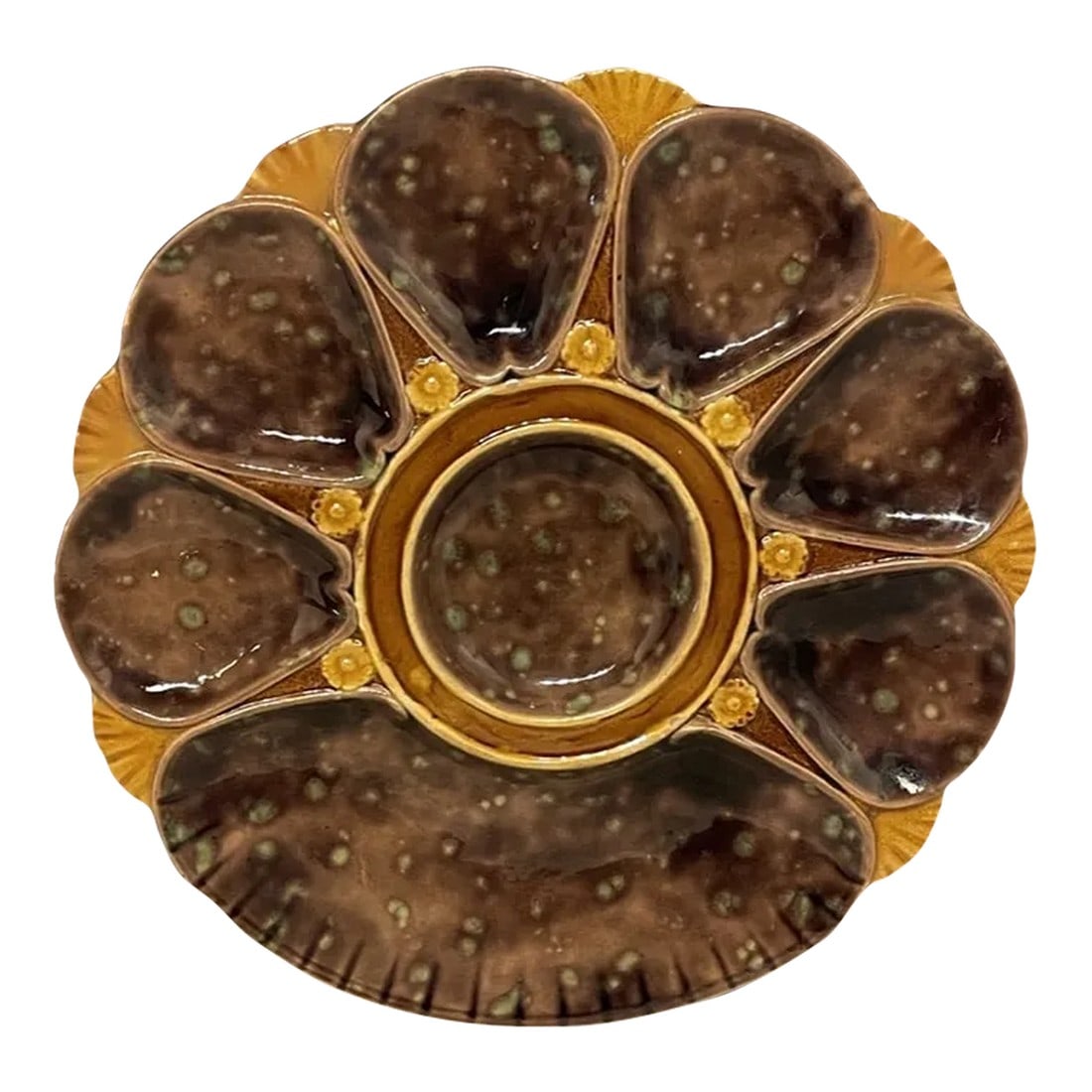 19th Century English Majolica Oyster Plate: A good 19th century English Majolica Oyster Plate, unusual brown color, with green back. Marks on the back 2239. The plate is in good condition measuring 10" diameter. C. 1880. No chips nor hairline
