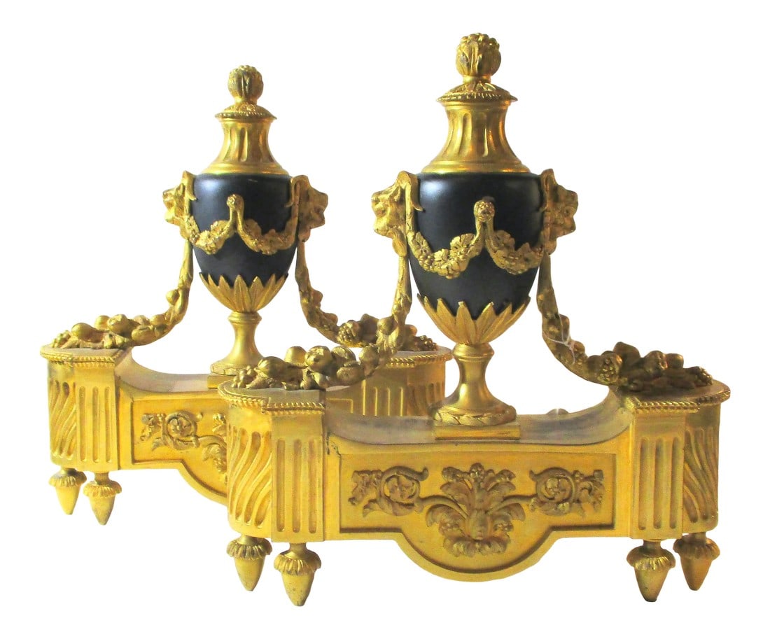 French Gilt Bronze Chenet 19th Century - a Pair of 2: Gilt bronze french Chenet andirons. late 19th century designs of garland draped urns over black enamel footed urns. Formal and heavily detailed construction in architectural language. The size is 10.5