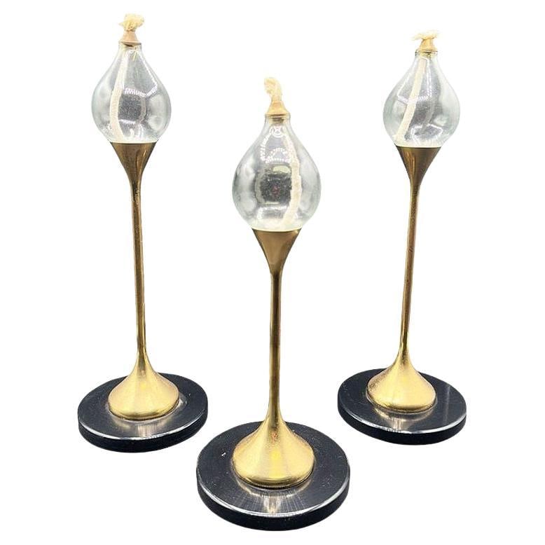 German Brass "Clear Drops" Oil Lamp Candlestick by Freddie Andersen, Set of 3: Title: German Brass "Clear Drops" Oil Lamp Candlestick by Freddie Andersen, Set of 3 Description: Original set of 3 Freddie Andersen "Clear Drops" oil lamps made in West Germany. This lamp set